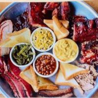 THE PIT PLATTER · 12 RIBS
12 WINGS
1 LB PULLED PORK
1 LB BRISKET
served with mac & cheese, collard greens, cor...