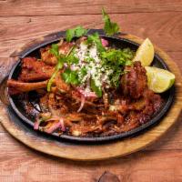 Carnitas Mexicanas · Slow roasted, juicy pork shank seasoned in our own secret juices. Served with Mexican rice, ...