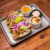 Southern Taco · 3 breaded and lightly fried chicken tacos, topped with pico de gallo, avocado and chipotle s...