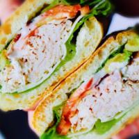 Woody Wood · House-roasted turkey, avocado, bacon, tomato, lettuce, Swiss cheese, cranberry relish, and t...