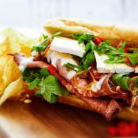 Cashman · House roasted beef, caramelized onions, roasted red peppers, roasted garlic, brie, arugula, ...