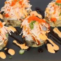Volcano Roll · Deep fried white fish, crab stick and cream cheese, topped with scallion, fish egg, crab sal...