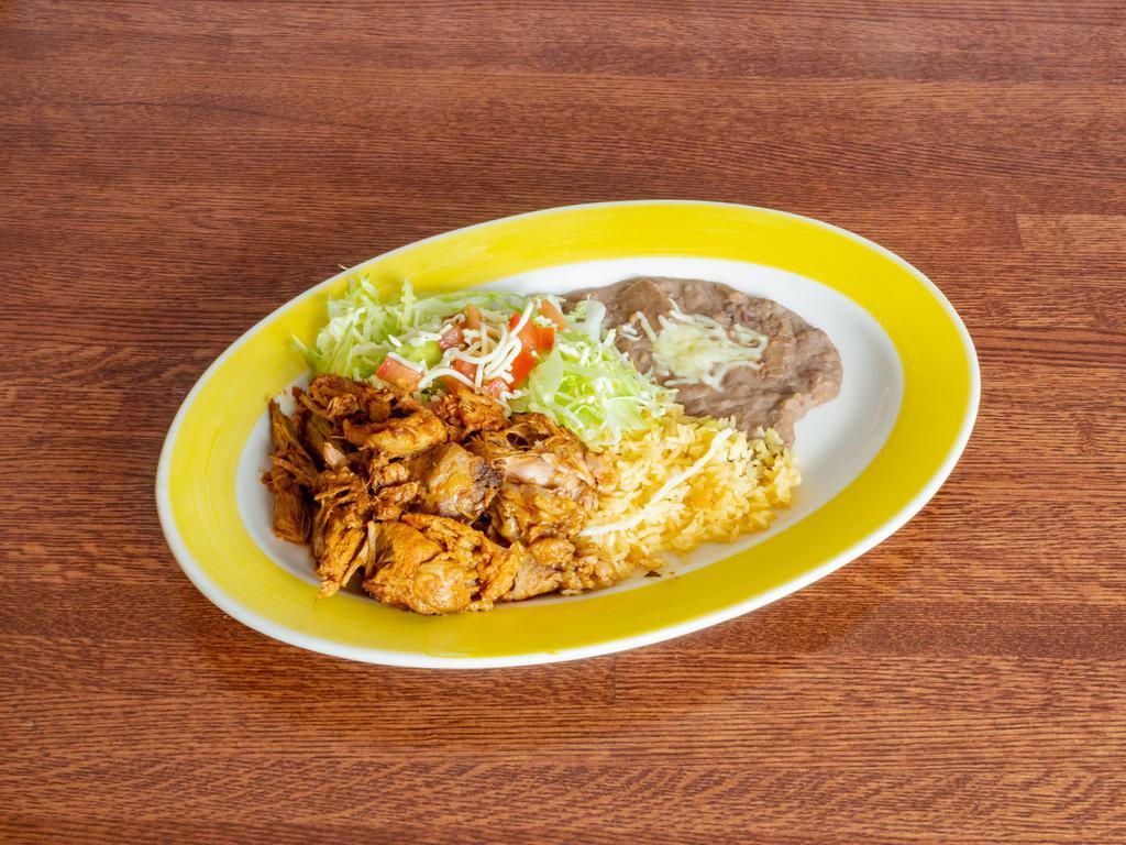 Carnitas Dinner · Delicious pieces of fried pork served with rice, beans refried or black, lettuce, tomatoes, guacamole, and tortillas flour or corn.