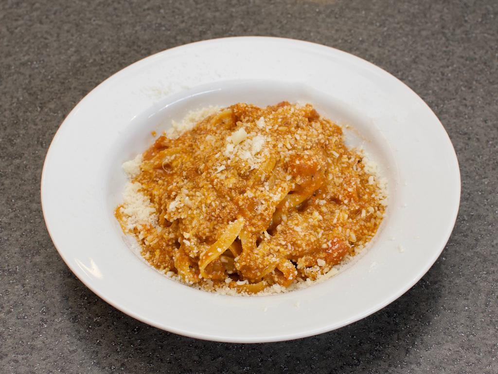 Fettuccine Alla Bolognese · Traditional Bolognese meat sauce. Served with Parmesan cheese.