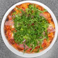 Prosciutto Rucola Pizza · Prosciutto, crudo, arugula, tomato and mozzarella flor di latte.