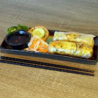 Banh Xeo Burrito · Rice paper wrap with Banh xeo, spicy ground pork, shrimp, cilantro, lettuce, mint, basil, on...