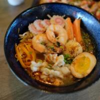 R4. Sapporo Ramen · Tonkotsu pork broth, thin noodles topped with Shrimp, imitation crab meat, snow crab, scallo...