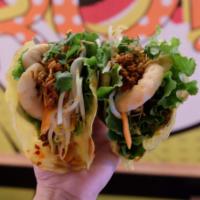 Taco Banh Xeo · Served with spicy ground pork, shrimp, beansprout, lettuce, cucumber, mint, cilantro, fried ...
