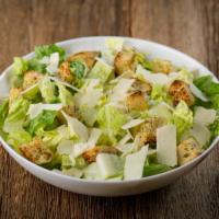 Caesar Salad · Crisp romaine lettuce hearts, toasted garlic croutons and shaved Asiago cheese. 
