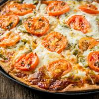 The Veggie Pizza · Mushroom, onion and green pepper with tomato on top. Vegetarian.