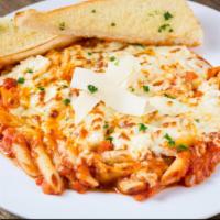 Three Cheese Baked Penne · A hearty pasta dish smothered in our homemade marinara sauce then baked with ricotta cheese,...