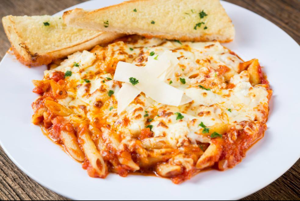 Three Cheese Baked Penne · A hearty pasta dish smothered in our homemade marinara sauce then baked with ricotta, mozzarella and Asiago cheese, topped with fresh parsley.