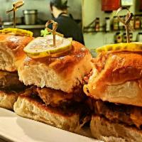 Henry's Sliders · Colorado raised all natural Angus sliders topped with caramelized onions, cheddar, and Henry...