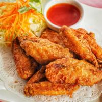 Fried Chicken Wings · 7 pieces. Served with sweet and sour sauce.