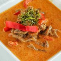 Red Curry · Red curry paste with coconut milk, bamboo shoot, bell pepper and basil.