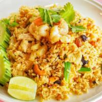 Pineapple Fried Rice · Chicken, shrimp, egg, pineapple, cashew nuts, onion and curry powder.