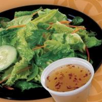 Side Salad · Cucumber and shredded carrots on a bed of crisp lettuce with your choice of dressing.