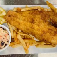 Fish & Chips Dinner · Large cut of fresh haddock, over a bed of crispy French fries. Served with coleslaw and tart...