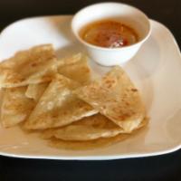 Roti Canai · Indian style pancake with curry dipping sauce. 