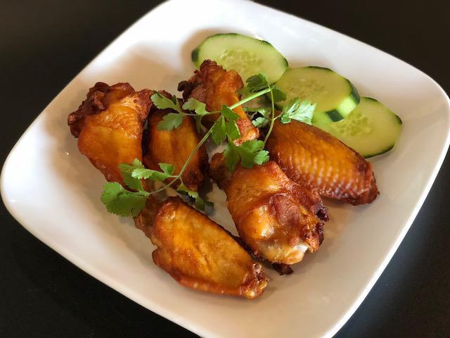 Asian Chili Hot Wings · Fried chicken tossed with a spicy and sweet sauce. 