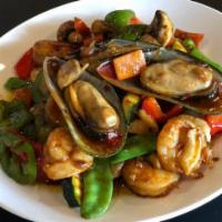 XO Seafood Combo · Shrimp, calamari, scallops, white fish and mussels cooked in a spicy seafood base.  Spicy.