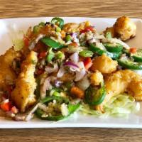 Salt and Pepper Shrimp · Battered and fried shrimp tossed with white pepper, sea slat and chilis. Spicy.