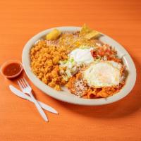 12. Chilaquiles Combo · Corn Tortillas in your choice of red or green salsa, topped with two eggs cooked to your sat...