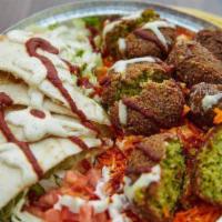 Falafel Over Rice Plate · falafel over rice and salad served with slice of pita bread chickpeas and your choice of sauce