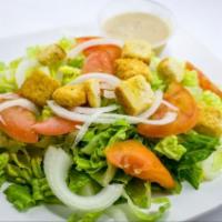 Caesar Salad · Romaine lettuce, croutons, tomato and onion with Caesar dressing