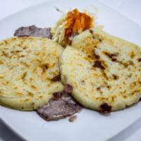 2 Frijoles con Queso Pupusas · 2 Beans and cheese pupusas with  cabbage mix with tomato sauce