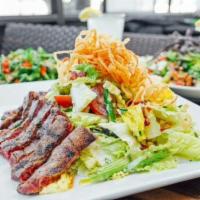 Grilled Skirt Steak Salad · Certified Angus Beef®, Romaine, Bacon, Bleu Cheese Crumbles, Asparagus, Cherry Tomatoes, Cri...
