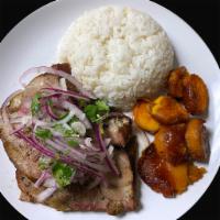 Pernil · roast pork topped with salsa criolla, served with sweet potatoes in a grand marnier sauce an...