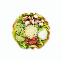 Tostada Salad · Tortilla shell, romaine, beans, guacamole, cheese, pico and sour cream with choice of meat.