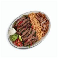 Fajitas · Grilled meat or seafood, roasted veggies, rice, your choice of black or pinto beans, sour cr...