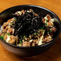 Chicken Karaage Donburi  · Steamed white rice, bite sized deep-fried chicken, crispy onions, kizame shredded nori, kewp...