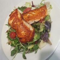 Herb Crusted Salmon Salad · Our famous salmon salad served on baby greens salad with cherry tomatoes, cucumbers, walnuts...