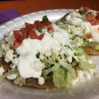 2 Tostadas · Fried corn tortillas, topped with refried beans, choice of meat, sour cream, queso fresco, l...