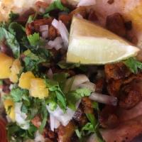 Chapultepec · 2 pastor tacos topped with grilled onions, pineapple and fresh cilantro. Served with choice ...