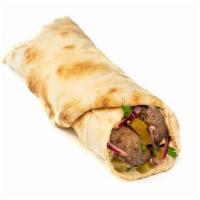 Kafta Lamb Kebab Classic Roll · Grilled seasoned ground lamb & beef, parsley-onion mix, hummus and cucumber pickles