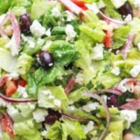 Greek Chopped Salad · Romaine, arugula & radicchio. Feta, tomatoes, Kalamata olives & red wine vinaigrette.