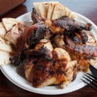 Whole Chicken · Served with pita bread. Chicken is cut up in pieces.