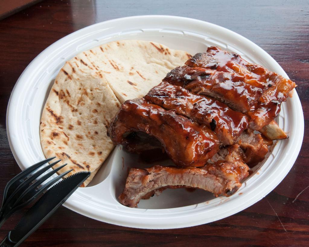 Baby Back Ribs · Served with a small Cole slaw and toasted pita bread. Additional sauce upon request. 