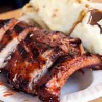 1/4 Baby Back Ribs Meal · Served with salad, pita bread and a choice of hot side. 