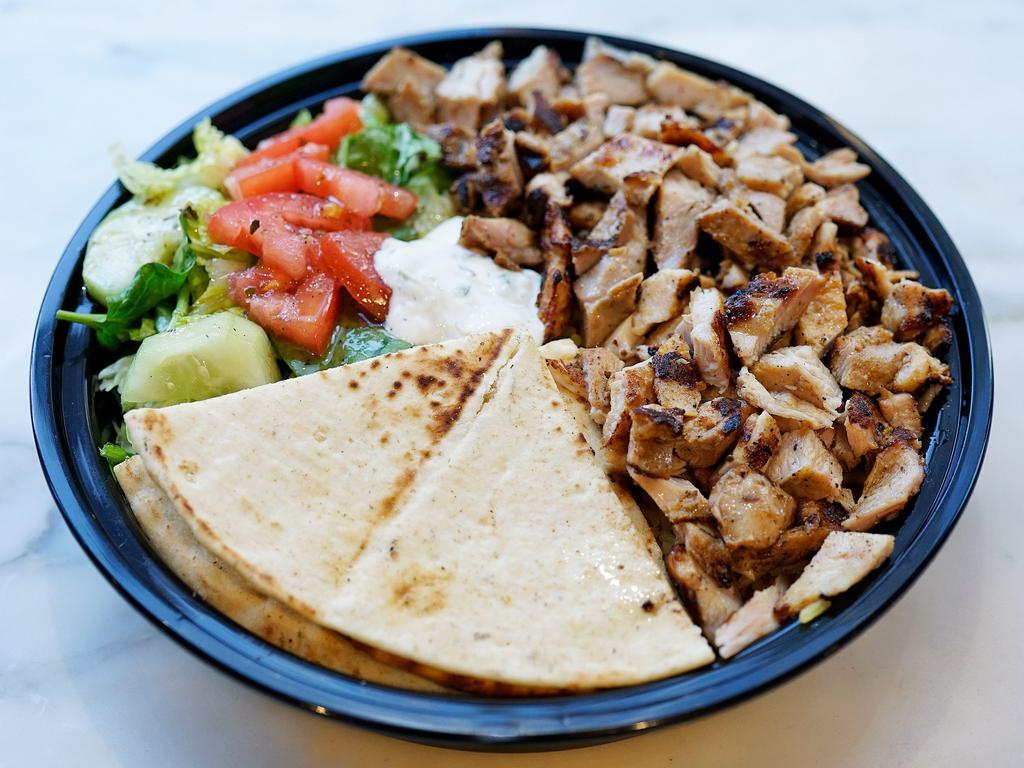 Chicken Shawarma Platter · Served with your choice of rice or french fries, salad, pita and tzatziki sauce.