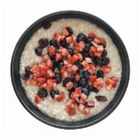Vegan Steel Cut Oatmeal · Organic oatmeal, fresh berries, and dried cranberries. Vegan.