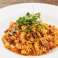 Fusilli Norcia · Sweet and hot sausage with light pink tomato sauce.