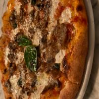 Pizza Funghi Misti · Porcini, oyster, shitake, oyster, and white mushrooms with mozzarella, tomato sauce.