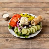 Greek Salad · Tomatoes, cucumbers, mixed greens, feta cheese, pepperoncini and Kalamata olives. Includes p...