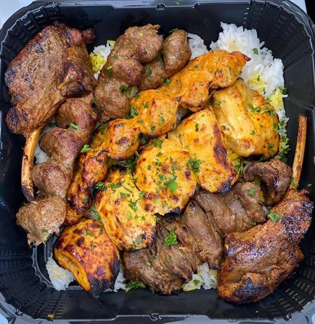 Sofreh Kabob TRAY ( 3 PEOPLE )  · COMES WITH 1 SKEWER OF CHICKEN SHISH KABOB, 1 SKEWER OF BEEF LULE, 1 SKEWER OF CHICKEN LULE, 2 LAMB CHOPS AND 3 GYROS 
SERVED WITH 3 SIDE OF HUMMUS AND 3 PITA BREAD  