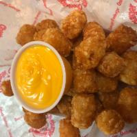 Tater Tots with a side of Cheese Sauce · 